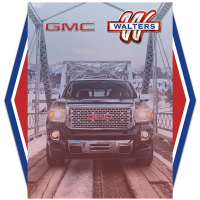 GMC truck in snowy forest Walters dealership